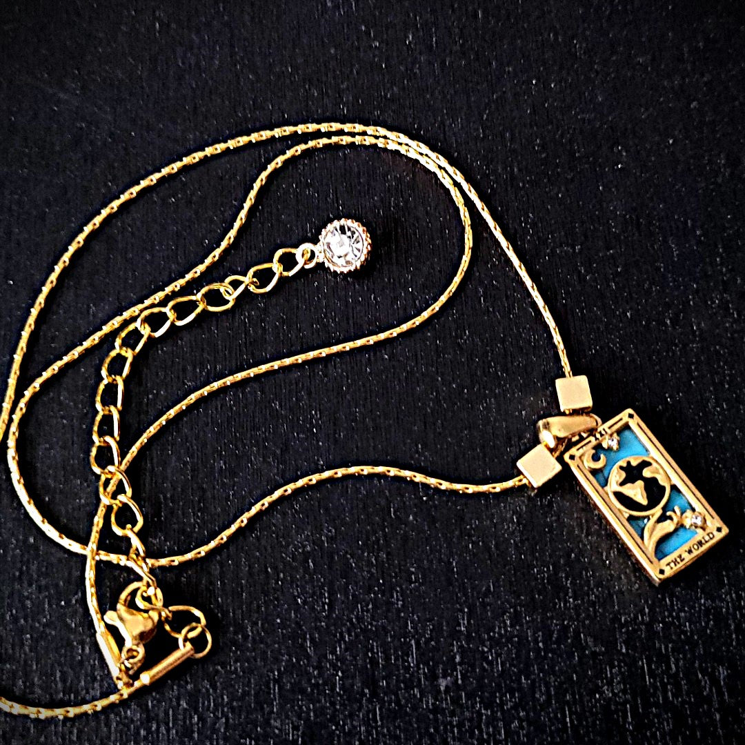 18kt world Tarot card necklace.